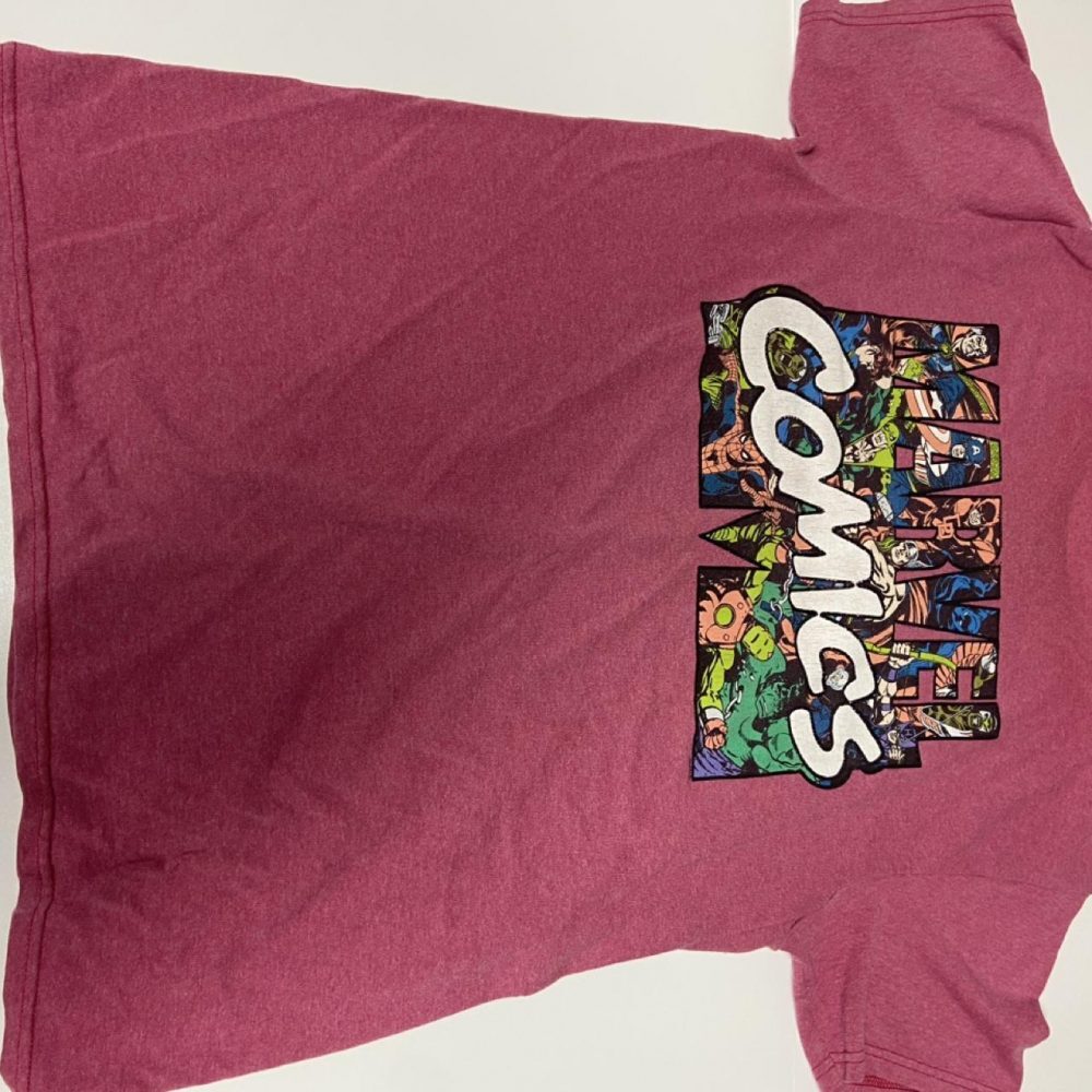Pink Marvel Comics tee with graphic featuring the word 'COMICS' and comic book c